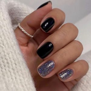 Short black acrylic nails for a sleek and stylish look.