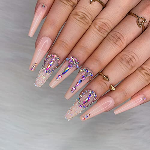 Sparkling acrylic nails with dazzling embellishments.