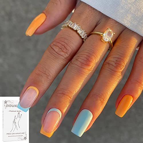 Blue and orange acrylic nails for a vibrant look.