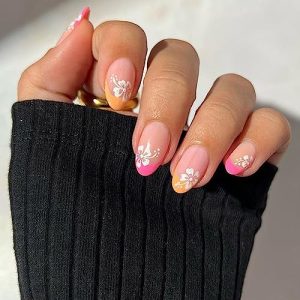 Orange and white acrylic nails for a vibrant look.