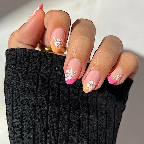 Orange and white acrylic nails for a vibrant look.