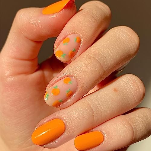 Acrylic nails in orange and green colors.