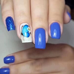 Blue butterfly design on acrylic nails.