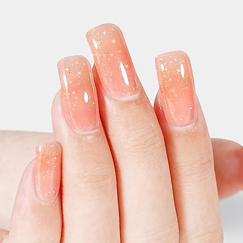 Sparkly orange nail polish for a dazzling manicure. - Image 3