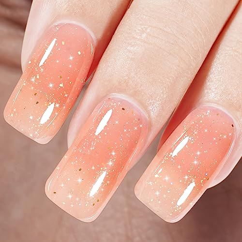 Sparkly orange nail polish for a dazzling manicure.