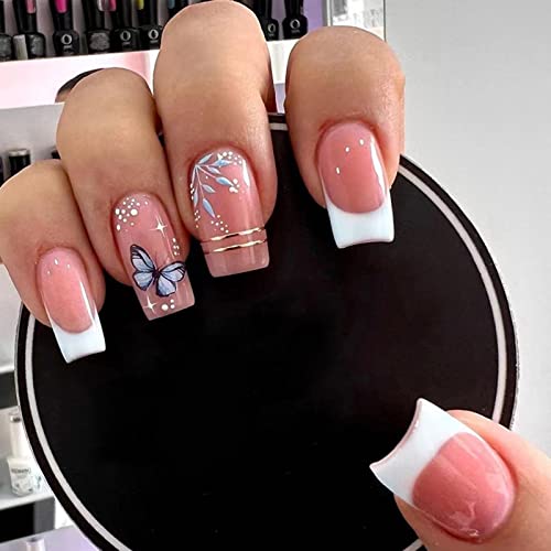 White butterfly design on acrylic nails.