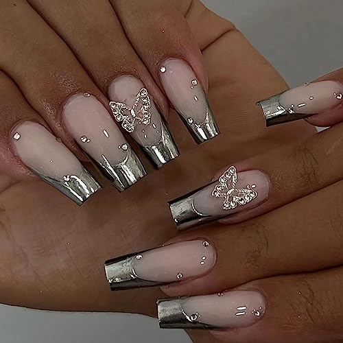 Sparkly acrylic nails with bling accents.