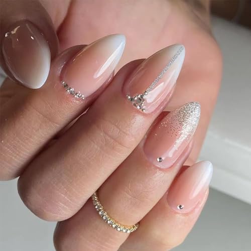 Sparkly almond-shaped acrylic nails.