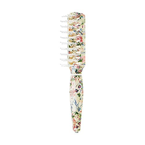Silver hair brush for luxurious grooming.