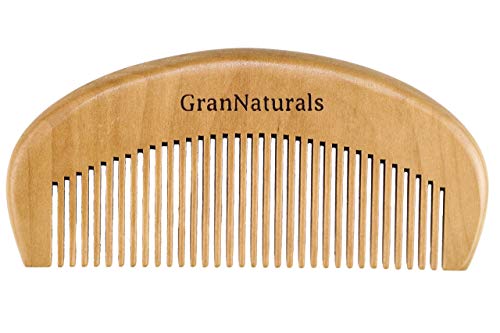 Natural hair comb brush for easy detangling and styling.
