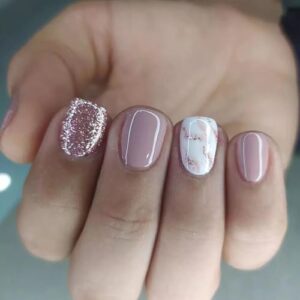 Pink marble design on acrylic nails.
