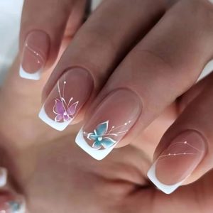 Butterfly design on short acrylic nails.