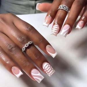 White flame design on acrylic nails.