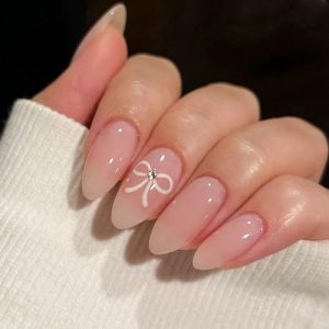 Nude Press on Nails Short Almond False Nails Solid Color Neutral Fake Nails with Glue Full Cover Bow Tie Glossy Stick on Nails Light Pink Nails Press on Acrylic Nails for Women Winter Nail Decorations