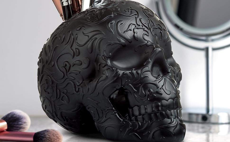 Black skull brushes mirror desk