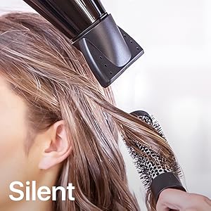 Photo of hairdryer being held close to someone’s ear