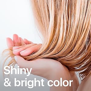 Photo of long blond hair gliding through fingers