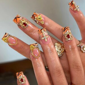 MERVF Square Press on Nails Medium Fake Nails Orange Tiger Print French Tip Glue on Nails with Gold Charms Press ons Heart Rose Cross Acrylic False Goth Squoval Nails for Women Glossy 24pcs