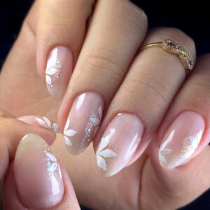 Short Press On Nails Almond, Nude Fake Nails accented with golden glitter and Graceful White Floral Petal Design, Glossy Gel Finish Acrylic Nails, Natural Reusable Glue On Nails Kit for Women, 24Pcs