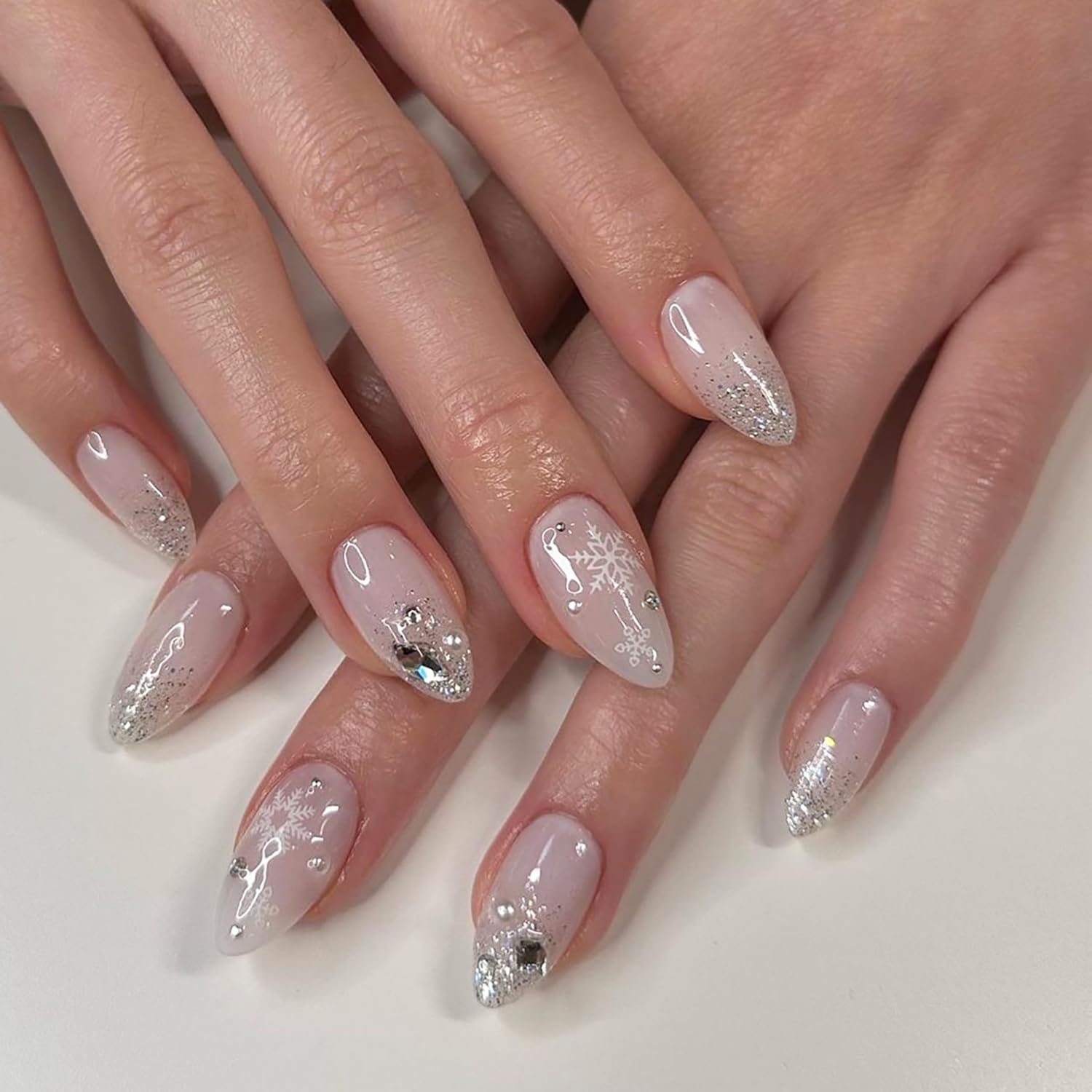 Christmas Press on Nails Almond Medium Snowflake Fake Nails with Nail Rhinestones Reusable Silver Glitter Acrylic Nails Snow Glue on Nails Full Cover Winter False Nails for Women Nail Designs 24Pcs