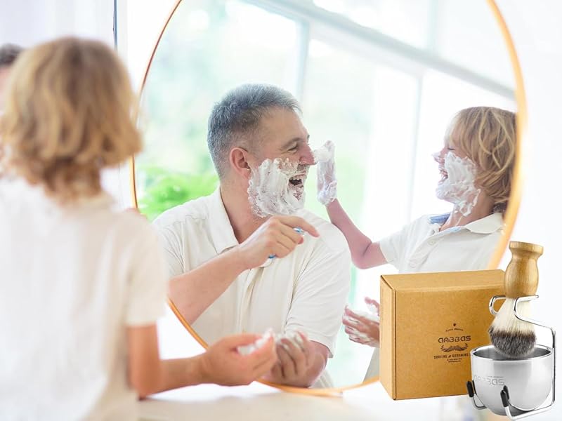 grandfather is making shaving foam happliy with grandson