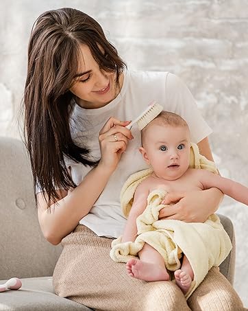 Romy Ro, Inc. Brand Story Mom with baby using wooden hair brush image
