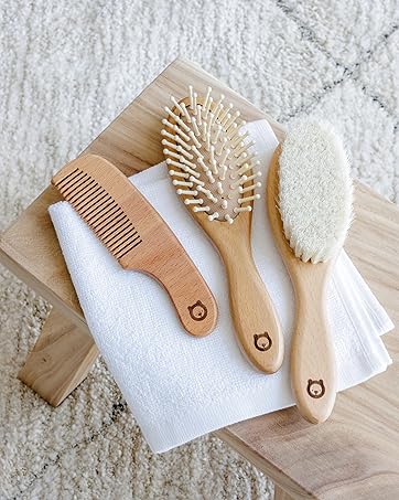 Romy Ro, Inc. Baby Wooden Hair Brushes on Wooden Bench Image