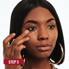 Close-up of a woman's face applying Rimmel Stay Matte Concealer