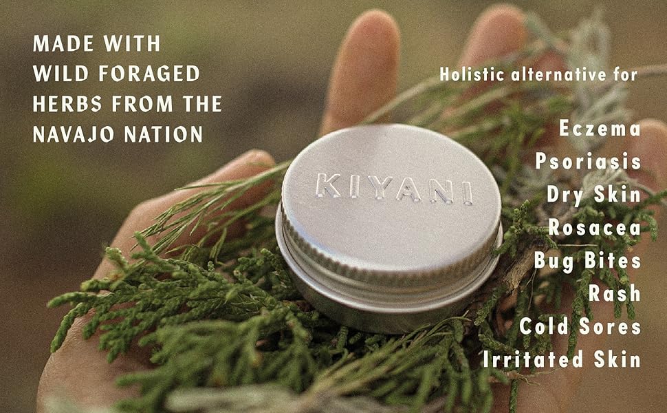 wild foraged herbs with salve in hand. for eczema, psoroasis, dry skin, rosacea,