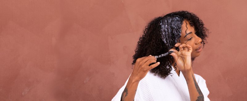 model holding leave in conditioner