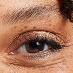 Sweep eyeshadow wand across the eyelid for a bold metallic look or blend makeup for a diffused look