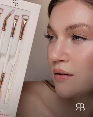 Close-up of makeup brushes in a white case, showcasing various sizes and shapes for different cosmetic applications.
