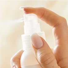 Image of a spraying detangler bottle