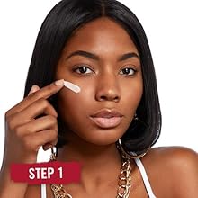 Close-up of a woman's face applying Rimmel Stay Matte Primer