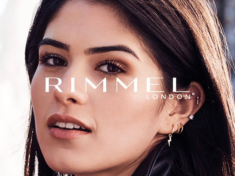 Close-up of a model with Rimmel London Logo
