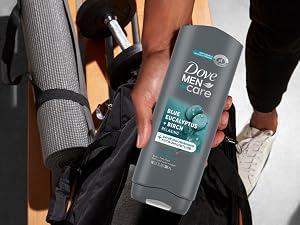 Hand pulling Dove Men Body + Face Wash bottle from a black backpack at the gym.