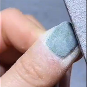 Remove the top Coat File the gel nails to remove top coat.