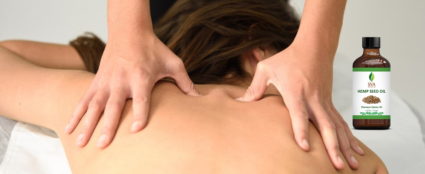 A person receiving massage by using hemp seed carrier oil from the amber glass bottle for body care