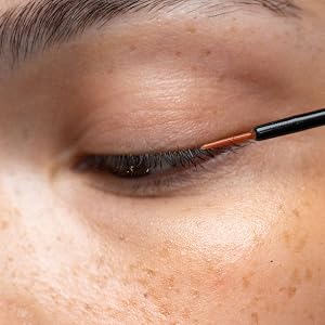 applying lash serum