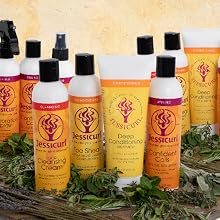 16 bottles of product on a wooden board with greenery around against an orange background