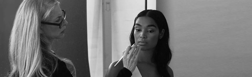 LORAC founder applying makeup to a model