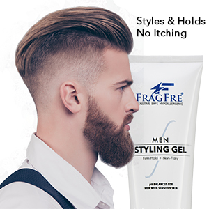 White man with mohawk hairstyle posing with a tube of FragFre firm hold men styling gel