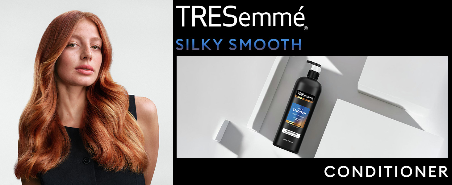 Red-haired model with soft waves beside a TRESemmé conditioner bottle on a modern white backdrop.