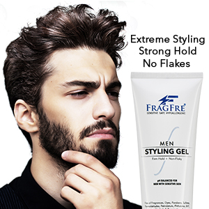 White man with stylish hair posing with a tube of FragFre firm hold men styling gel