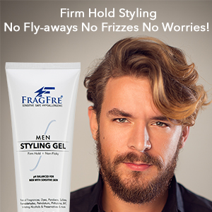 White man with stylish hair posing with a tube of FragFre men styling gel firm hold